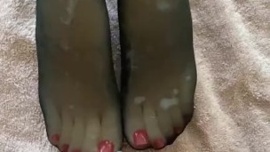 Big load on nylons feet and red toes