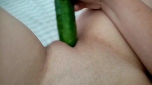 Sexy wife fucking herself with a cucumber
