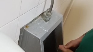 Big cock piss at urinal