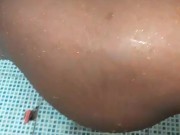 Preta favelada tomando banho e lavando a buceta 15/16