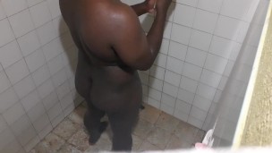 Thicc black man taking a shower 
