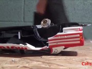 Goddess Calista sprays a miniature sports car