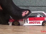 Goddess Calista sprays a miniature sports car 3/16