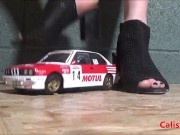 Goddess Calista sprays a miniature sports car 4/16