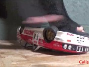 Goddess Calista sprays a miniature sports car 7/16