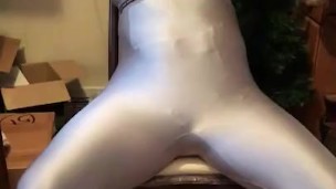 Self bondage :  belt to chair, gagged, and handcuffed wearing spandex. 