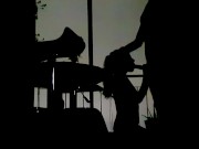 Silhouettes in the balcony at night