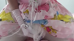 Sissy princess cums whilst caged and plugged in diaper with magic wand