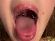 Swallowing gummy bears with open mouth