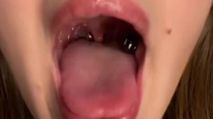 Swallowing gummy bears with open mouth