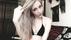 cute blonde camgirl brushes her long silvery hair