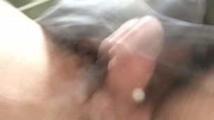Never-ending pee. View from the bottom of a glass. Balls and uncut POV