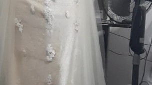 Crossdresser wearing bridal dress