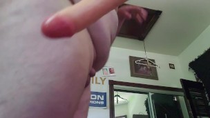Chubby guy uses huge dildo