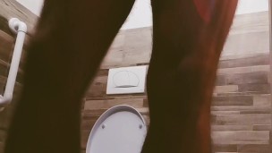 A guy with a big cock locked the toilet and masturbated. Long slow cumshot. 