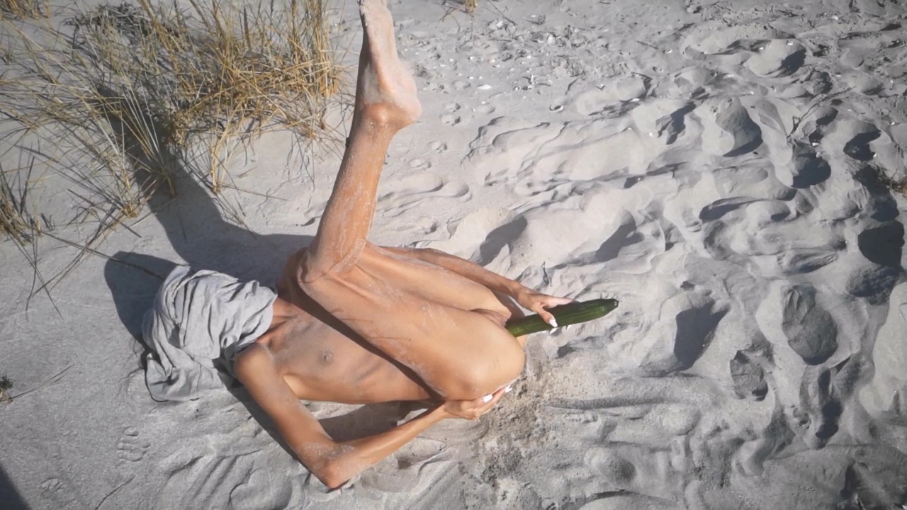 Amateur nudist teen fucks her tight pussy with a huge cucumber on a public beach. Ends with a pee. - Free Sex Video - RedTube