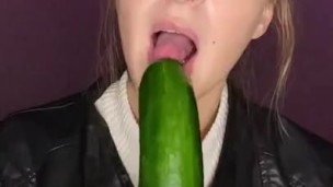 Cucumber sucking. Leather jacket 