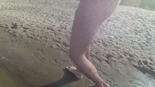 Walking naked on the beach