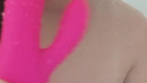 Chubby busty girl teases in the shower with vibrator