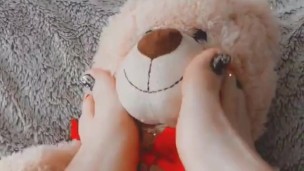 Teddy bear gets worshipped with her feet