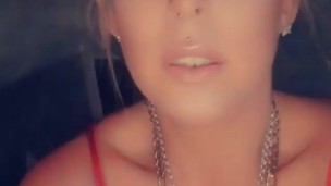 Hot milf with big tits and tattoos smoking a cigarette