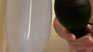 Young Sissy Inserts Massive Inflatable Butt Plug