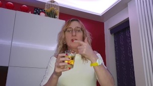 Lisa pissing in a glass then having a taste