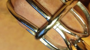 Urethral sounding for locked in chastity cage cock. Close up.