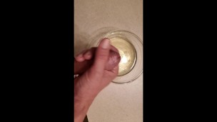 Piss and cum into a bowl. Using piss as lube.