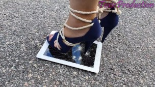 Ipad crushed under metal tipped stilettos