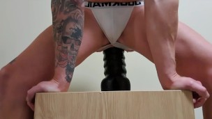 Young lad rides a monster dildo making his ass gape