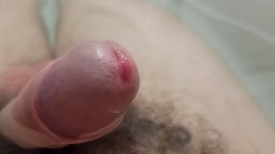 Extreme closeup uncut pissing cock