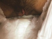 A girl with a hairy pussy pissing in a diaper.  12/16