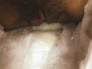 A girl with a hairy pussy pissing in a diaper.  13/16