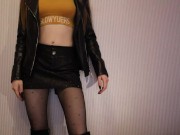 Skinny girl in boots and leather shorts moves sexually 2/16