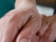 She squeezed the greased up penis to the brink during this impressive handjob clip. 16/16