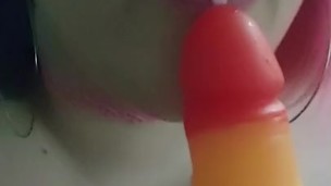 Topless BBW cam girl gives her dildo a blowjob 