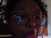 Milf gives pink dildo a blow job