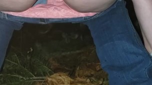 Peeing in the woods along the side of the road