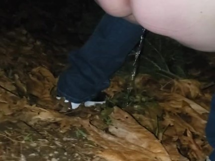 Peeing in the woods along the side of the road
