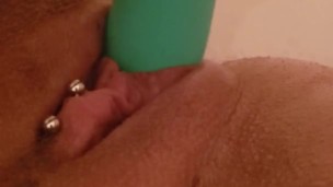 Young milf pleasuring herself in the bathtub
