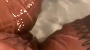 Mullato ebony rubs pussy in tub