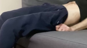 Wanking in jogging bottoms, my big cock cumming.
