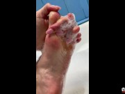 show and caress my feet in the bathroom. Soft and gentle feet in foam