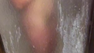 Watching her shower, she briefly presses her tits & ass on the glass door to tease me with her body 