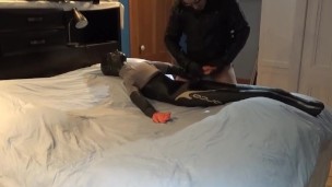 leather jacketed pantyhosed cowboy plays with his crop top dummy
