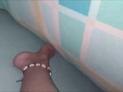 PLAYING UNDER THE SHEETS. GIRL TOUCHES HER WET PUSSY