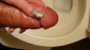 Real amateur girlfriend holds my big white dick and controls my piss while I pee in the toilet 