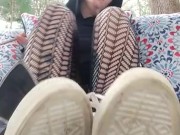 Smokes a cigarette and teases with fishnets and daisy dukes outside 1/16