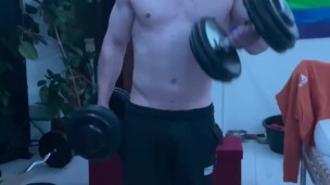 Working out at home shirtless heavy curls 